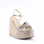 Gold-toned woven espadrille-style wedge sandal with an ankle strap and buckle.