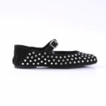 Black suede Mary Jane flat with a buckle strap and silver stud embellishments across the body