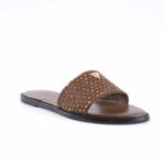 Brown slide sandal with a studded strap featuring multicolored rhinestones over a black sole.