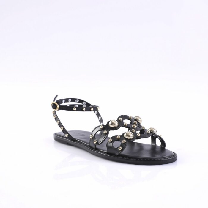 Black flat sandal with studded straps and gold-tone studs, open toe.