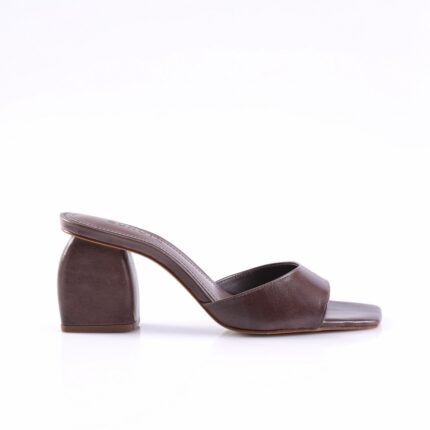 Brown leather open-toe mule with a low block heel, side view.