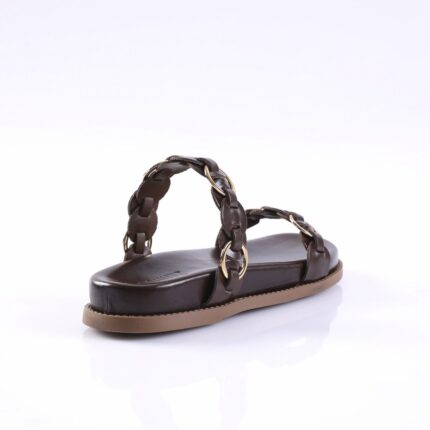 Brown leather slide sandal with braided straps and gold rings, showing side view on white background