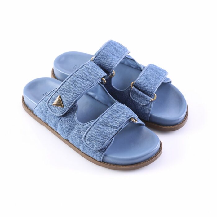 Blue denim slide sandals with two Velcro straps and a brown sole, open-toe design.