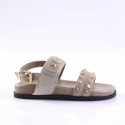 Beige suede sandal with two embellished straps and gold stud hardware, low black sole.