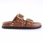 Brown leather slide sandal with two studded straps and gold buckles on a black sole