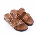Brown leather sandals with gold studs and buckles, open-toe slide straps on a black sole.