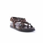 Brown suede sandal with decorative metal studs and colorful gemstone accents, open toe and ankle strap.