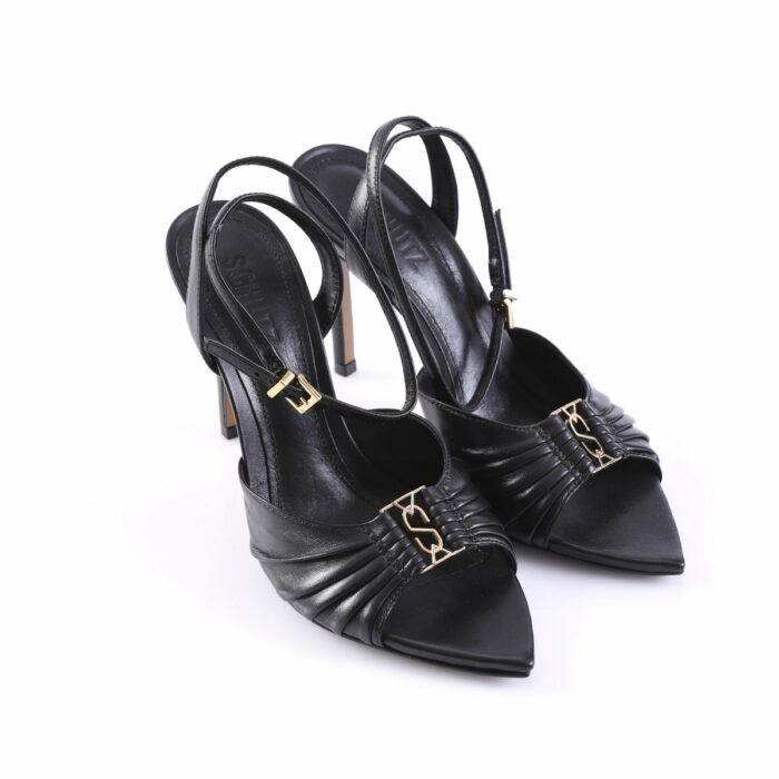 Black strappy heeled sandals with pointed toes and gold buckle detail on a white background, side view.