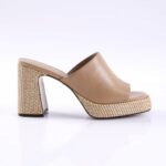 Beige leather mule with a woven, chunky block heel and platform, open toe, side view.