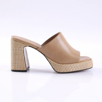Beige leather mule with a woven, chunky block heel and platform, open toe, side view.