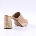 Beige open-back platform mule with a woven straw block heel, shown from the side