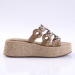Tan leather platform sandal with a braided jute wedge heel and studded straps, designed for women.