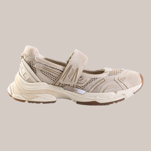 Beige athletic sneaker with a Velcro strap and breathable mesh panels, showing a chunky light sole.