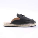 Black leather slip-on espadrille with rope-wrapped sole and stitching along the edge