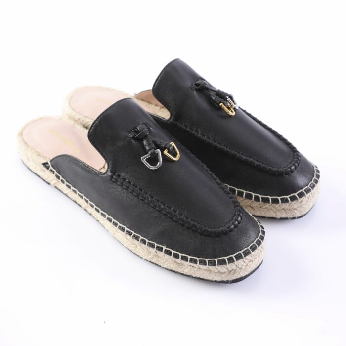 Black leather espadrille slip-ons with a braided jute sole and decorative metal hardware on the vamp.