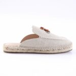 Beige canvas espadrille mule with a rope-wrapped sole, shown from the side.