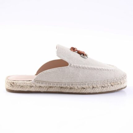 Beige canvas espadrille mule with a rope-wrapped sole, shown from the side.