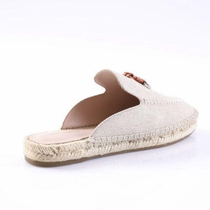 Beige espadrille slide with woven rope sole and braided leather embellishment on top view