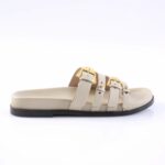 Beige slide sandal with four straps and gold buckles on a black sole.