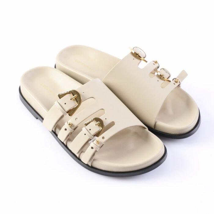 Beige leather sandals with multiple gold-buckle straps and a black sole, shown as a pair.