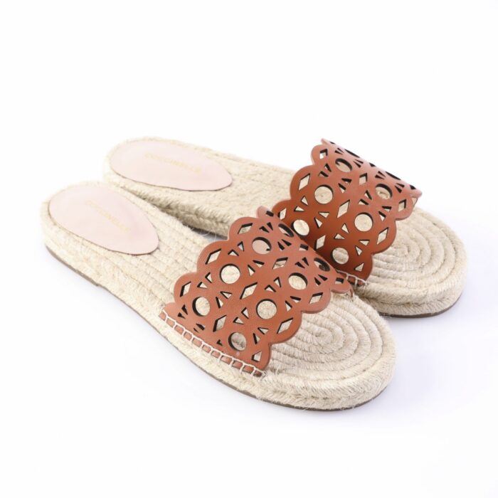 Pair of tan espadrille slide sandals with braided jute sole and a brown cutout leather strap