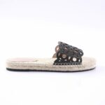 Black cut-out slide sandal with a woven jute sole on a white background, product photo.