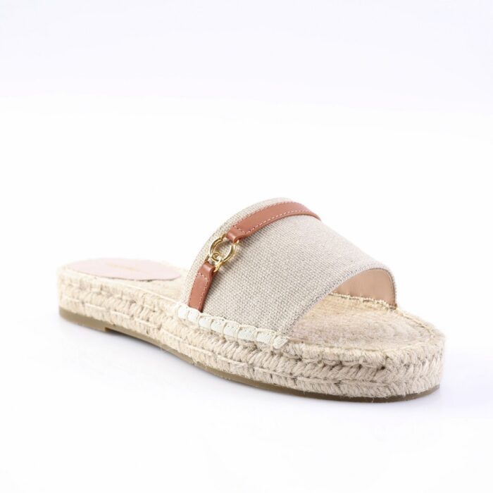 Beige fabric espadrille slide with a pink-brown leather strap and small gold ring detail over a woven jute sole.