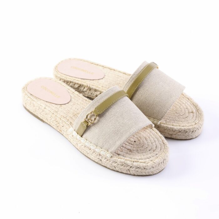 Beige espadrille sandals with a woven jute sole and beige fabric strap with a small gold buckle.