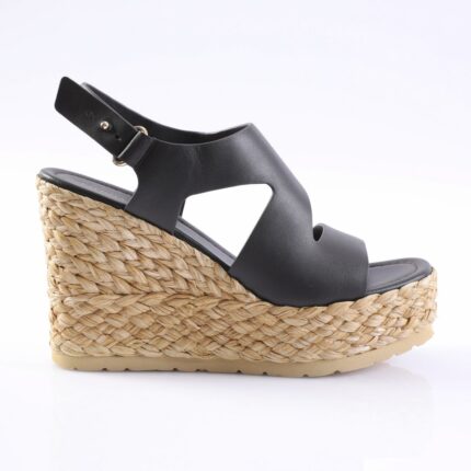 Black leather wedge espadrille sandal with a braided jute platform and ankle strap/buckle detail.