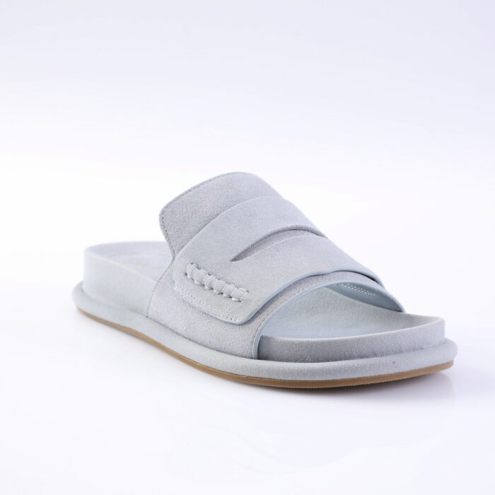 Light gray suede slide sandal with two overlapping straps and a padded sole on a light background, product photo