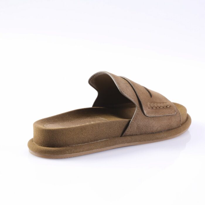 Brown suede slide sandal with a wide strap and stitched edge on a white background.