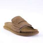 Brown suede slide sandal with a wide strap, decorative stitching, open toe, and contoured footbed.