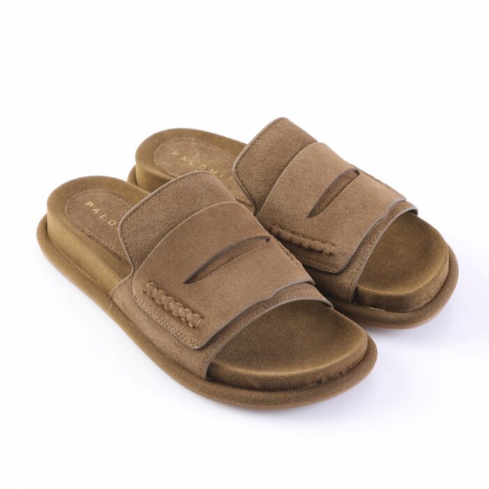 Brown suede slide sandals with two wide straps and stitched detailing on a white background.