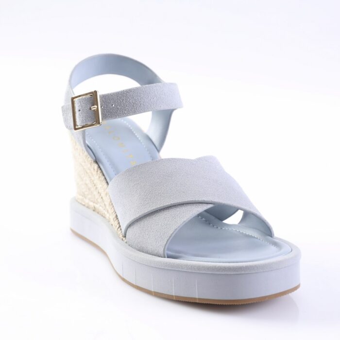 Light blue wedge sandal with two straps and gold buckle on a white background, featuring a woven espadrille heel and platform outsole.