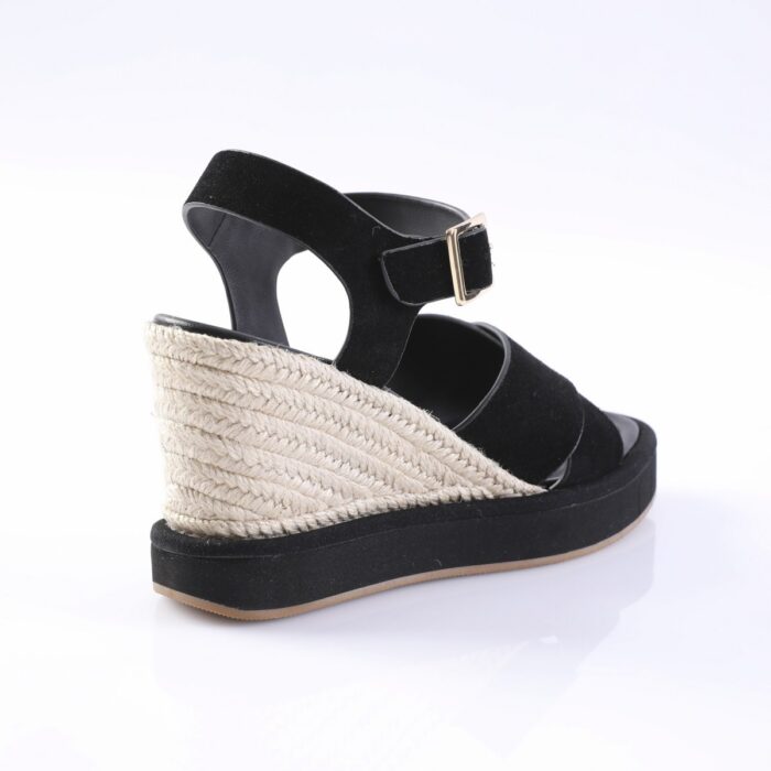 Black suede wedge sandal with ankle strap, gold buckle, and rope-wrapped espadrille heel (side view)