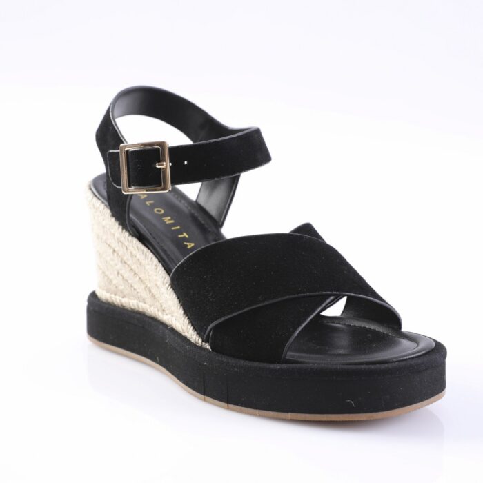 Black wedge sandal with crisscross straps and ankle buckle on a jute-wrapped heel, platform sole visible.