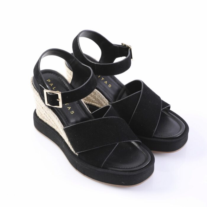 Black wedge sandals with ankle straps and beige braided rope heel; platform sole on a white background.