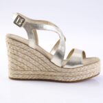 Silver metallic wedge sandal with ankle strap and braided jute platform.