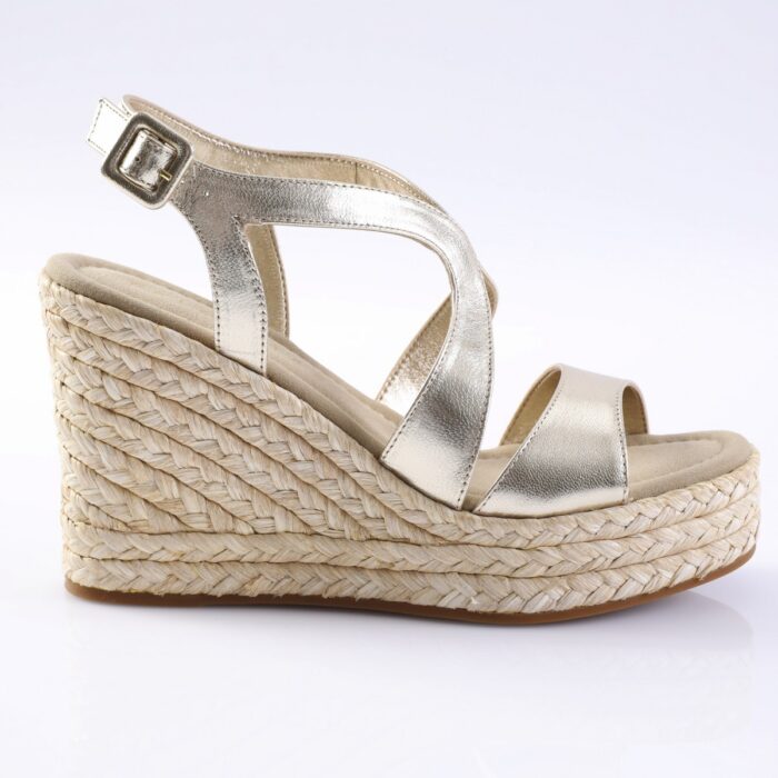 Silver metallic wedge sandal with ankle strap and braided jute platform.