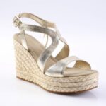 Gold metallic wedge sandal with braided espadrille heel and ankle strap.
