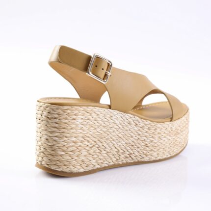 Beige platform wedge sandal with braided rope sole, tan leather straps, and ankle buckle
