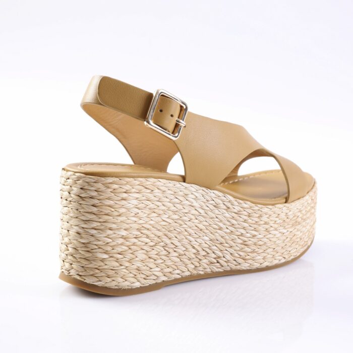 Beige platform wedge sandal with braided rope sole, tan leather straps, and ankle buckle