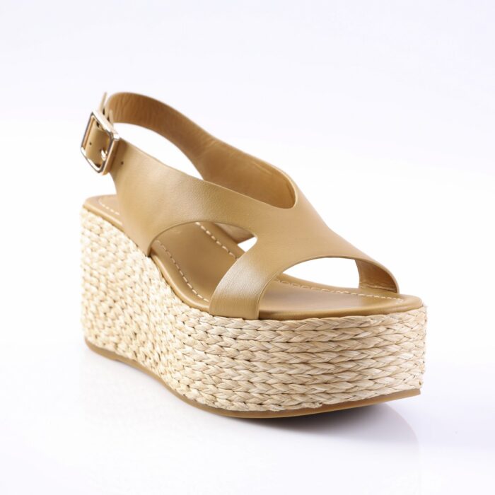 Beige leather wedge sandal with a braided jute platform and ankle buckle