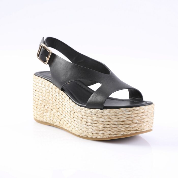 Black leather wedge sandal with a braided jute platform and ankle strap with a gold buckle.