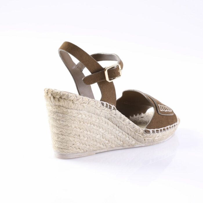 Brown suede wedge espadrille sandal with an ankle strap and gold buckle, featuring a braided jute sole.