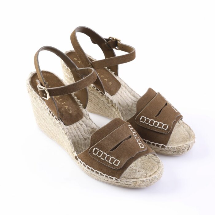 Brown suede wedge sandals with ankle straps and white stitched detailing on the toe straps, jute-wrapped sole.