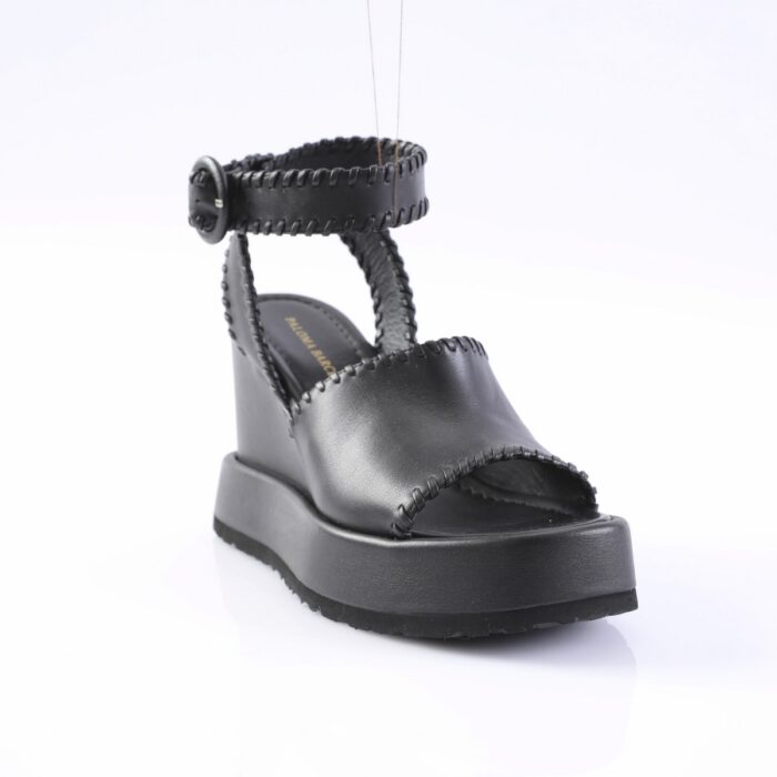 Black leather platform sandal with ankle strap and buckle, open toe, white background