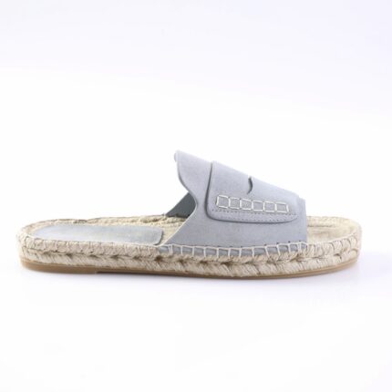 Light blue suede slide sandal with a thick woven rope sole and stitched strap details