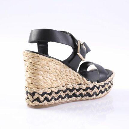 Black leather espadrille wedge sandal with braided jute sole and ankle strap.