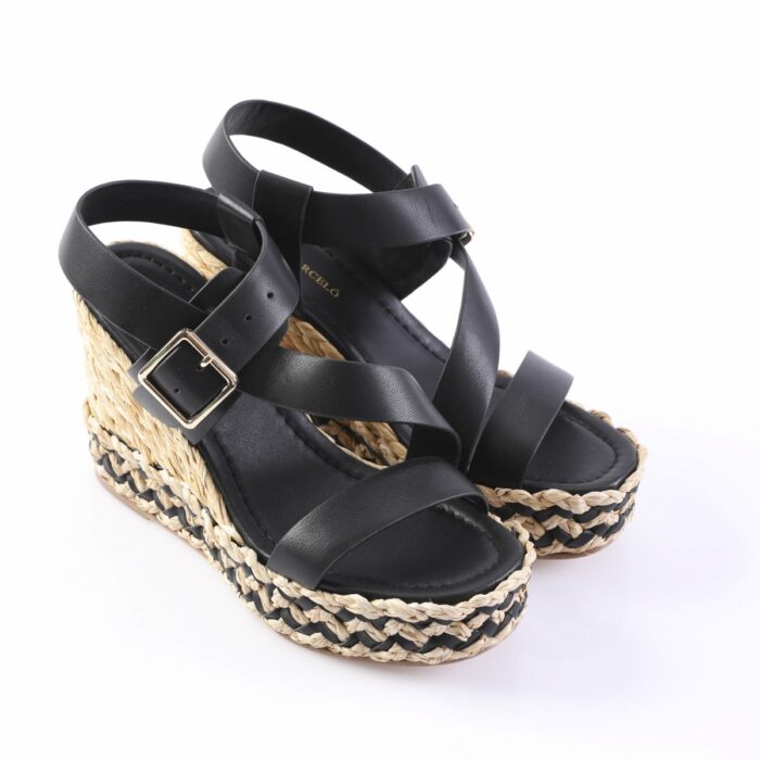 Black leather wedge sandals with ankle strap and buckle, featuring a braided jute sole.